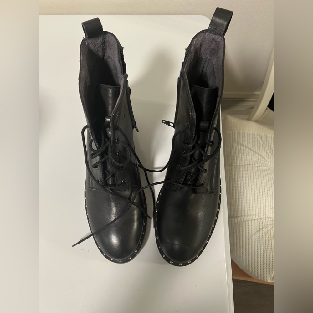 Women’s Size 10 black leather boots by Seycheller with silver studs around boots